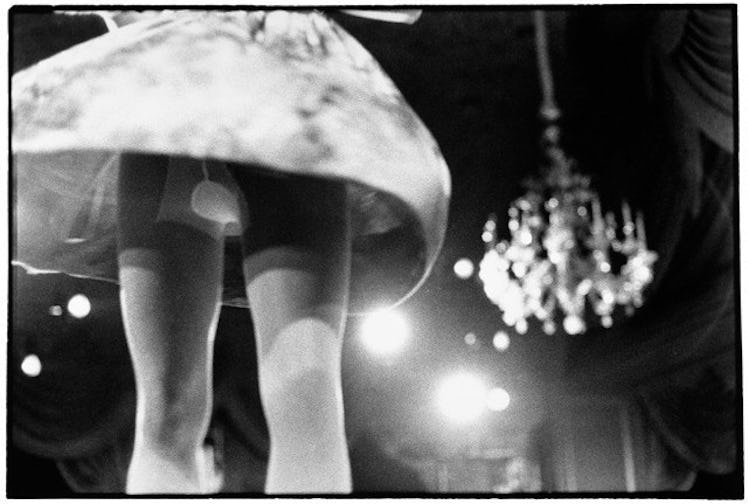 Zoe Leonard, “View from Below, Geoffrey Beene Fashion Show,” 1990. featuring a woman dancing in a sk...