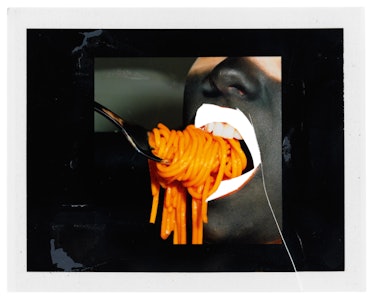 Miles Aldridge's polaroid featuring a mouth full of spaghetti and a fork