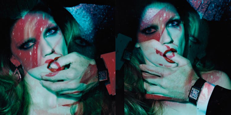 Miles Aldridge's polaroid featuring  a man's hand over a woman's mouth and a finger in her mouth