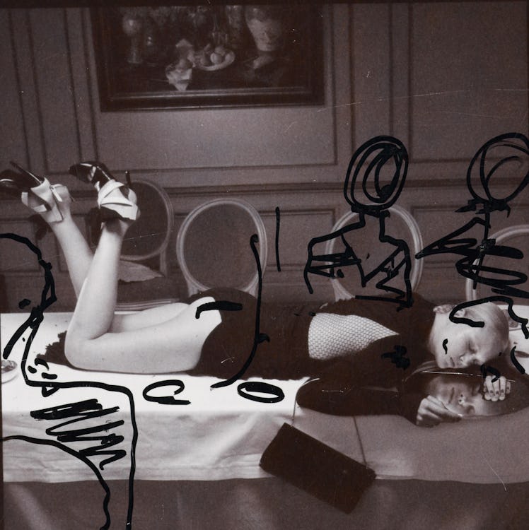 Miles Aldridge's polaroid featuring a woman lying over a dining table and sketched people sitting on...