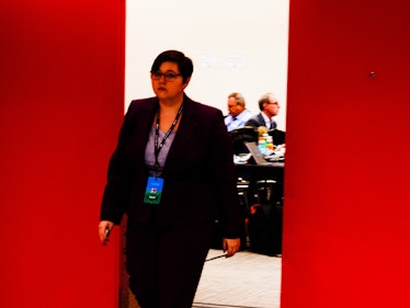 A woman in a suit walking out of a room at Jacob K. Javits Convention Center at Hillary Clinton's el...