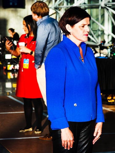 A woman in a blue jacket looking into the distance at Hillary Clinton's election night party 