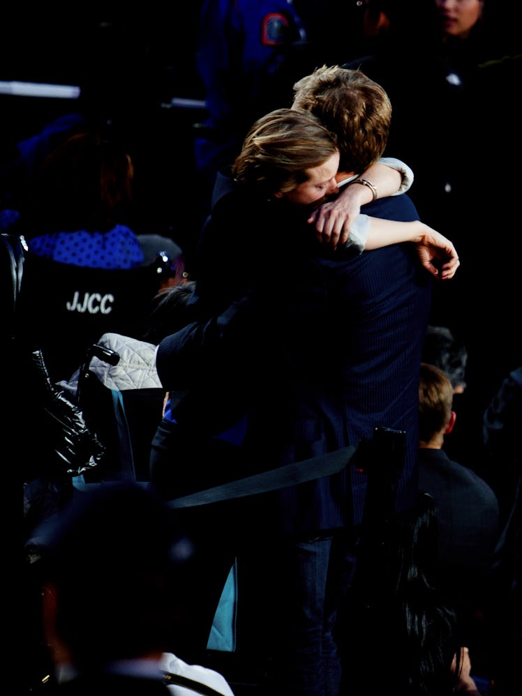 Two people hugging at Hillary Clinton's election night rally 