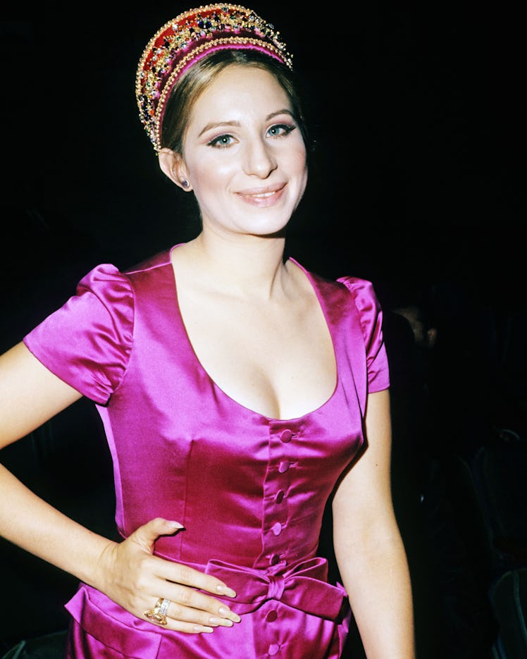 Barbra Streisand in a pink satin dress and pink embroidered and beaded crown in 1965