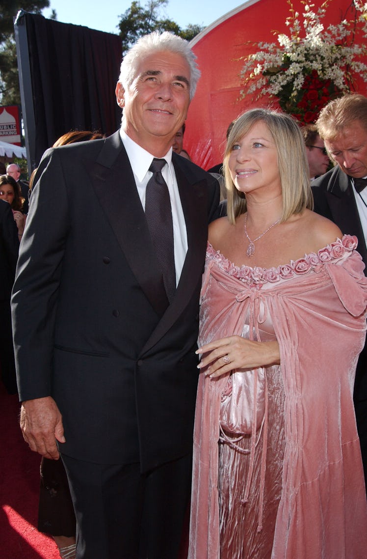 James Brolin in a black suit and a white shirt and tie and Barbra Streisand in a pink gown at the An...
