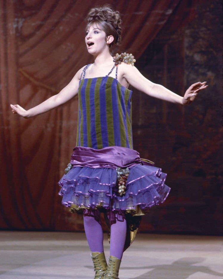 Barbra in a striped purple and green dress, as the performer Fanny Brice in the musical film “Funny ...
