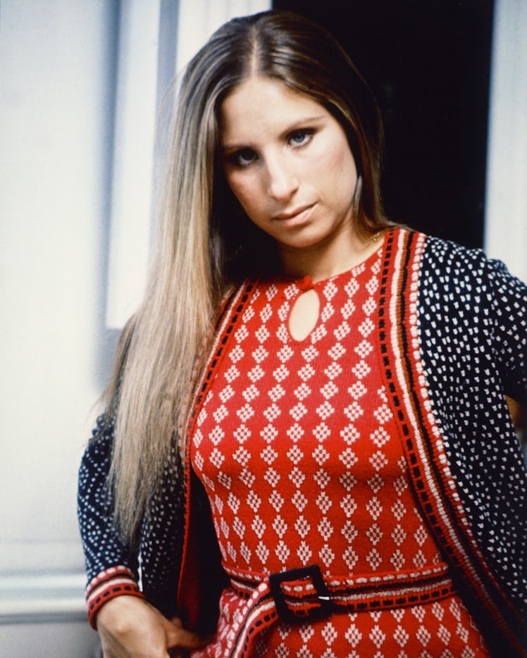 Barbra Streisand in a knit red-white top and black-red cardigan in 1965