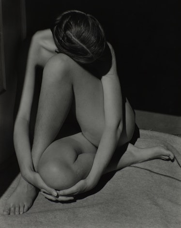“Nude” photo of a naked woman sitting on floor taken by Edward Weston