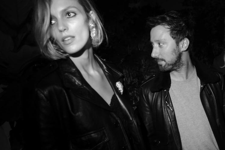 Anja Rubik & Anthony Vaccarello wearing leather jackets and walking