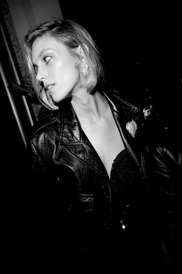 Anja Rubik looking to the right while wearing a black leather jacket