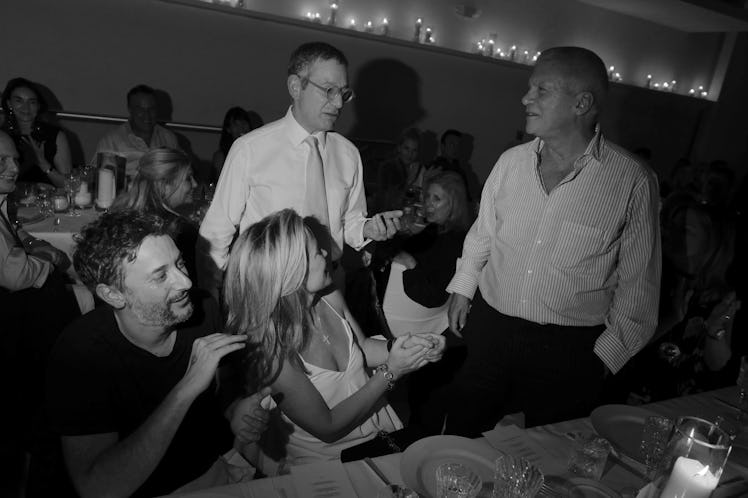 Harmony Korine Chrissie Erpf Jeffrey Deitch & Larry Gagosian standing and sitting at a table and hav...