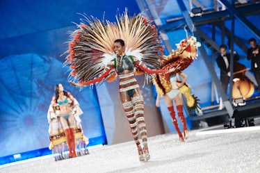 Maria Borges in a white-lace outfit and large striped multi-colored wings t the 2016 Victoria’s Secr...