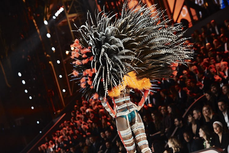 Maria Borges in a white-lace outfit and striped multi-colored wings t the 2016 Victoria’s Secret Fas...