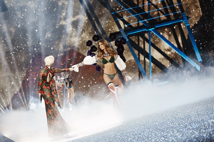 Lady Gaga and a model in a black-white outfit at the 2016 Victoria’s Secret Fashion Show 