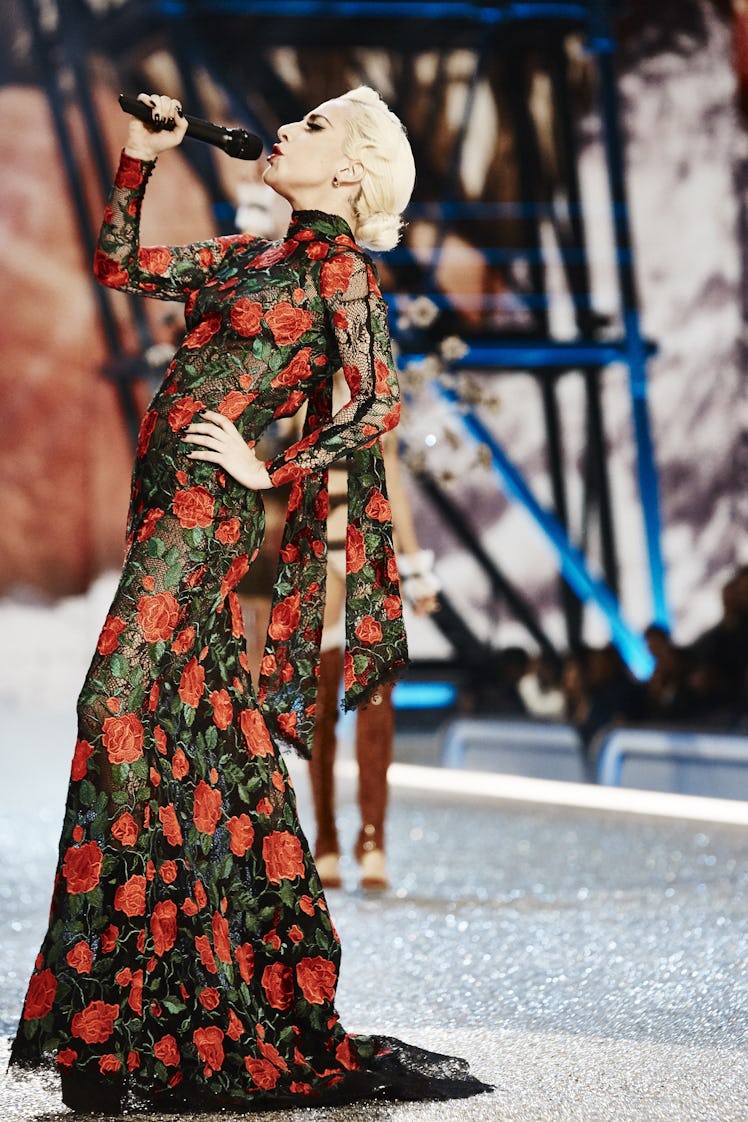 Lady Gaga in a black-red floral dress performing at the 2016 Victoria’s Secret Fashion Show 