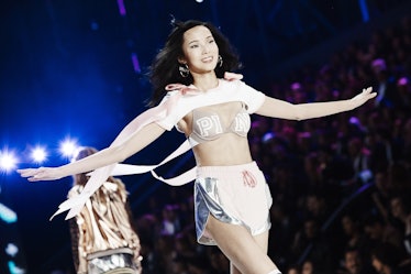 A model in a white top and skirt at the 2016 Victoria’s Secret Fashion Show 