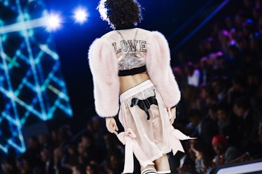 The back of a model in a white-black jacket and skirt at the 2016 Victoria’s Secret Fashion Show 