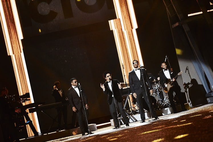 Four men in black tuxedos and white shirts performing at the 2016 Victoria’s Secret fashion show