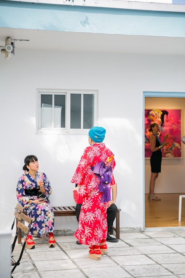 Two women in traditional kimonos at Art Basel Miami Beach in 2016.