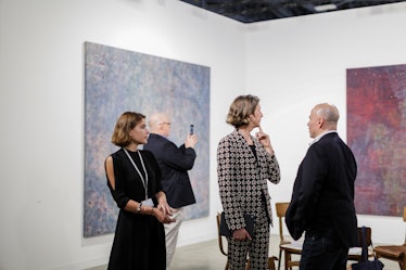 Attendees exploring artwork at the 2016 Art Basel Miami Beach.