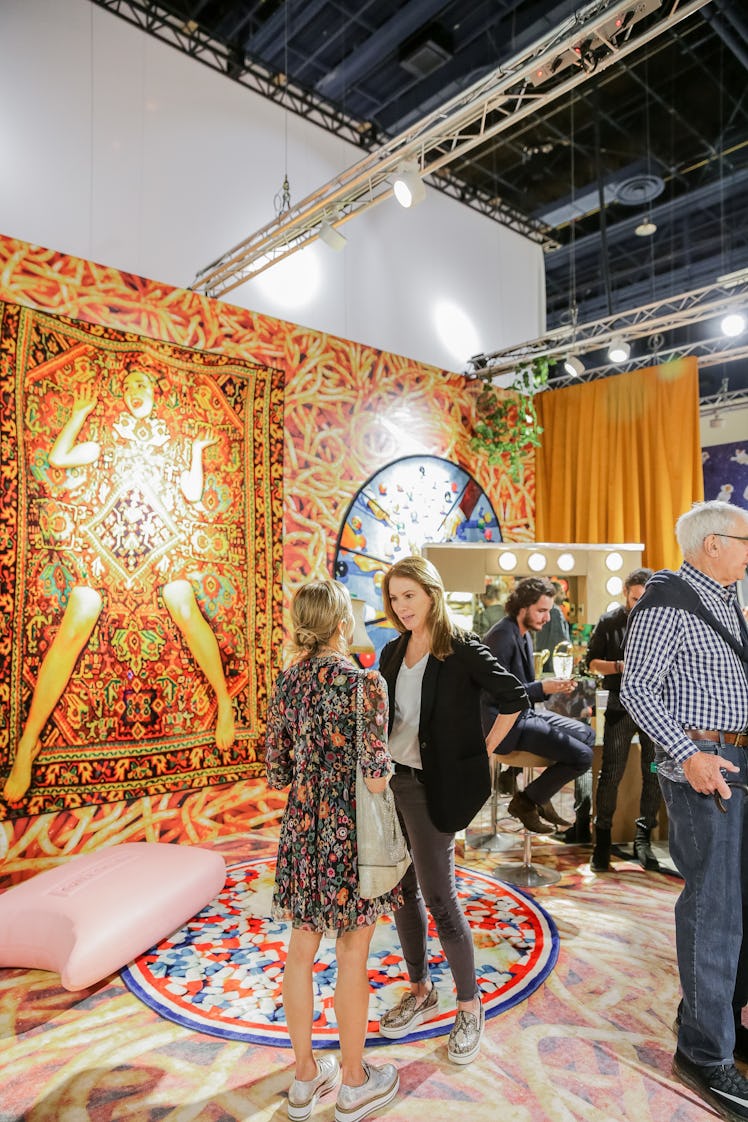 Two women talking at Art Basel Miami Beach 2016.