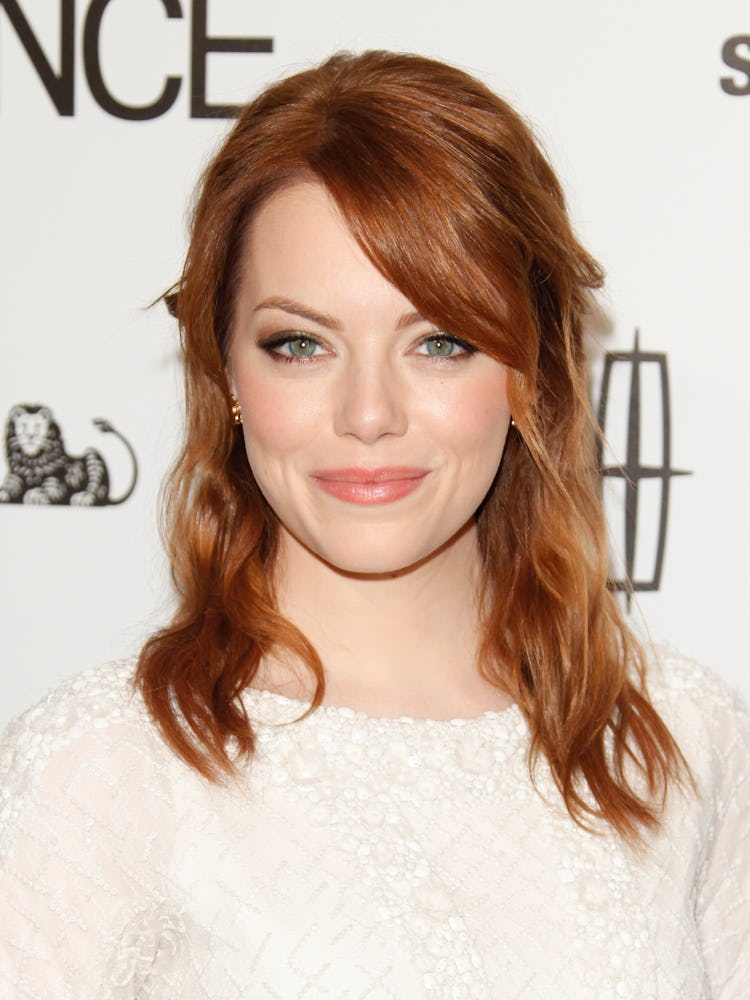 Emma Stone with red hair loosely pinned back at the 5th Annual Essence Black Women in Hollywood Lunc...