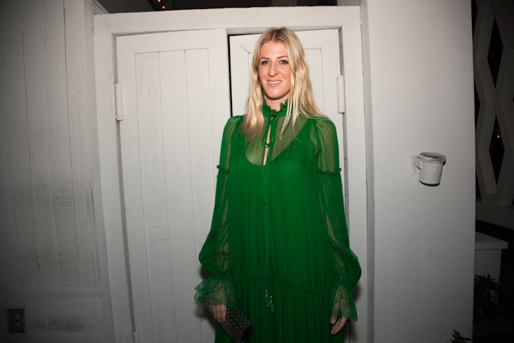 A woman in a green tulle maxi dress during Whitney + Tiffany’s dinner after party.