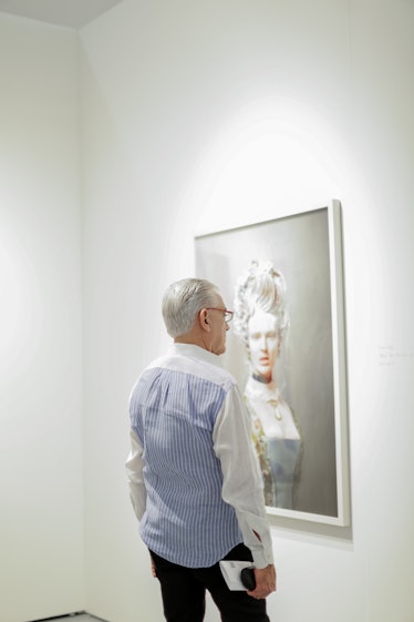 A man looking at the painting at the 2016 Art Basel Miami Beach event.
