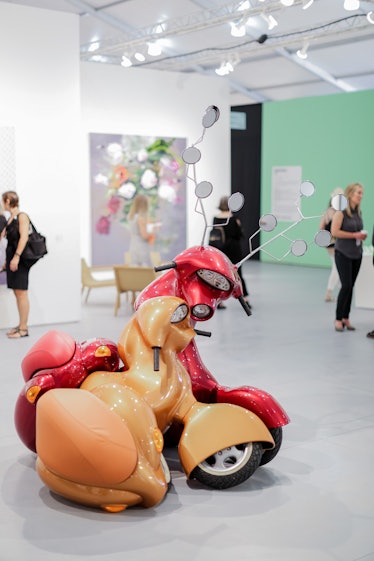 An art installation featuring two scooters showcased at the 2016 Art Basel Miami Beach event.