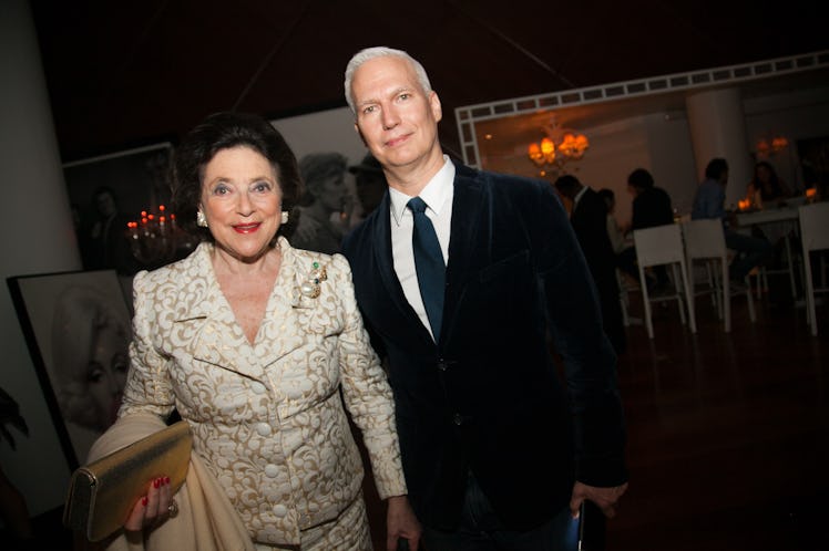 Klaus Biesenbach with a friend attending Moschino Miami party