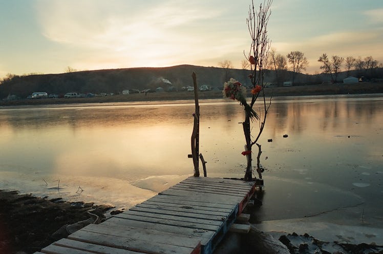 A lake pier extending over the water's surface at Standing Rock