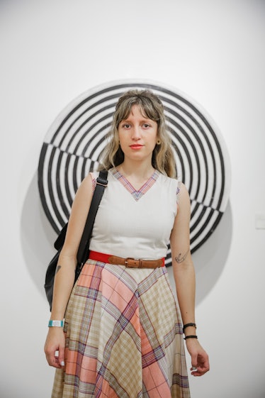 A woman wearing a dress with plaid details at Art Basel Miami Beach 2016.