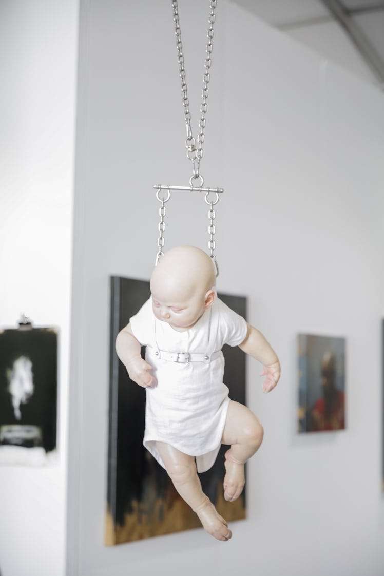 A sculpture of a newborn baby displayed at the 2016 Art Basel Miami Beach.