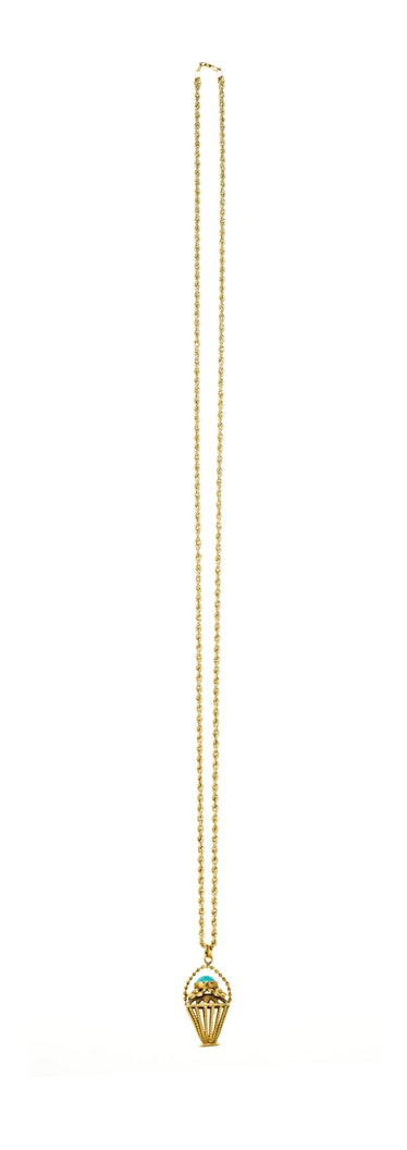 The Row golden necklace with ice-cream-shaped pendant.