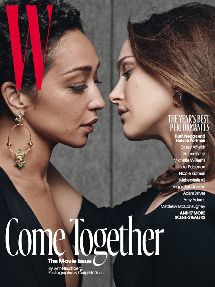 Ruth Negga in a black top and Natalie Portman in a black top about to kiss on the cover of W Magazin...