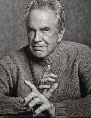 A portrait of Warren Beatty in a sweater in black and white