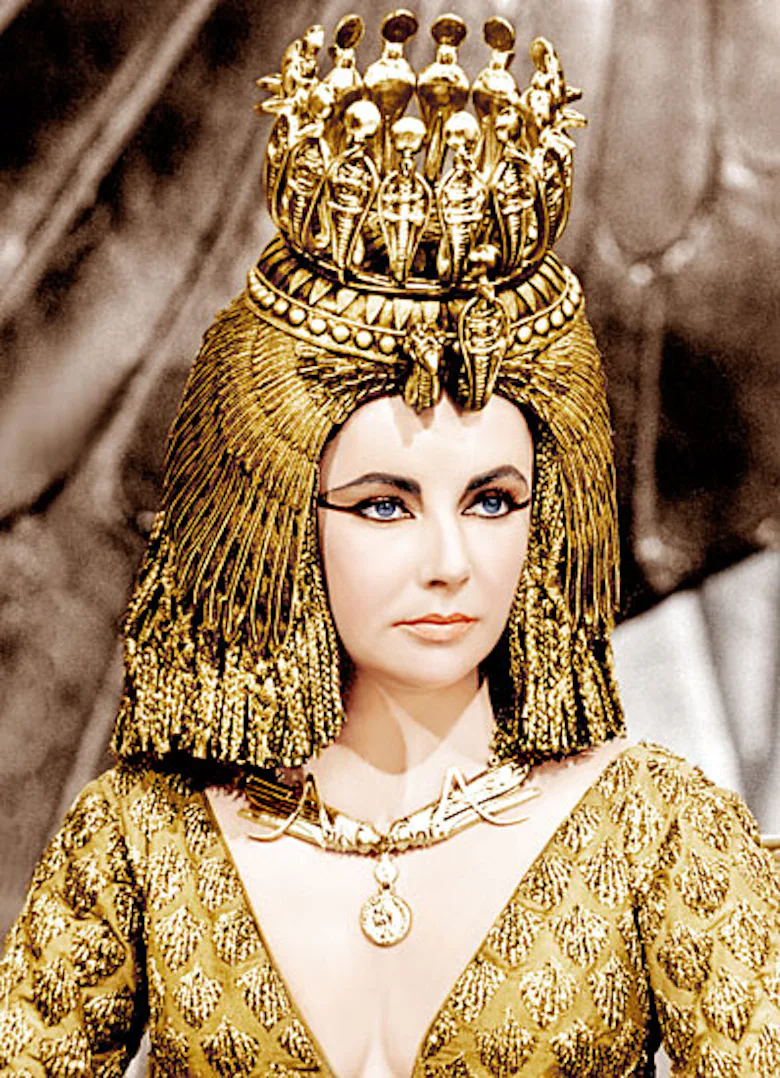 elizabeth taylor gold dress Elizabeth Taylor in 1967, wearing an intricate sari dress designed by Cristobal Balenciaga