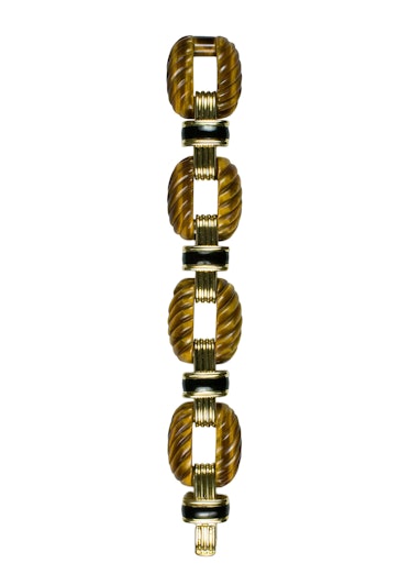 David Webb gold, tiger’s-eye, and enamel bracelet, $40,600, David Webb, New York, 212.421.3030.