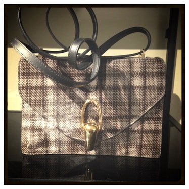 We have our eye on this glen plaid pony hair bag from [Giorgio Armani](http://www.wmagazine.com/mood...