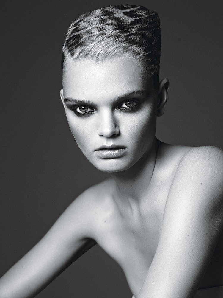 A model with a pixie cut and a smoky eye in black and white 