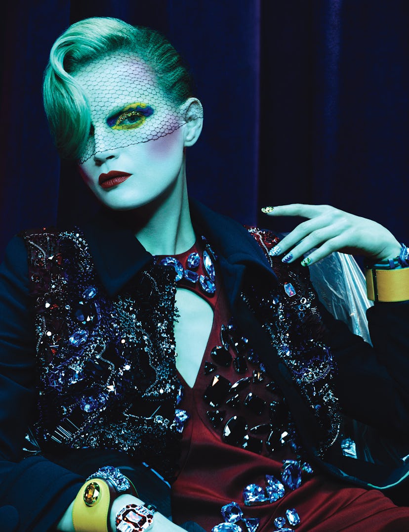 Prada coat, dress, and bracelets.