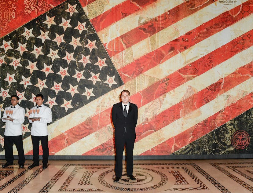 Shepard Fairey in front of his print