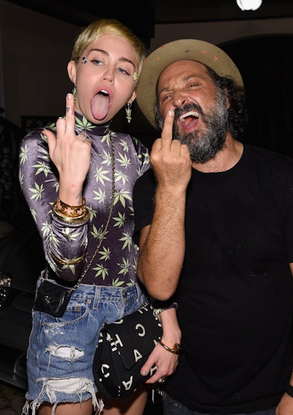 Miley Cyrus and Mr. Brainwash attend the Haute Living Hublot party at the estate of JR and Loren Rid...