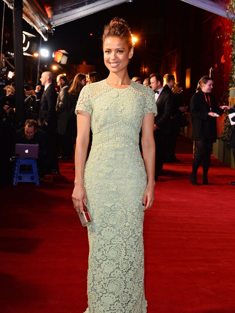 Gugu Mbatha-Raw standing while wearing a light green gown