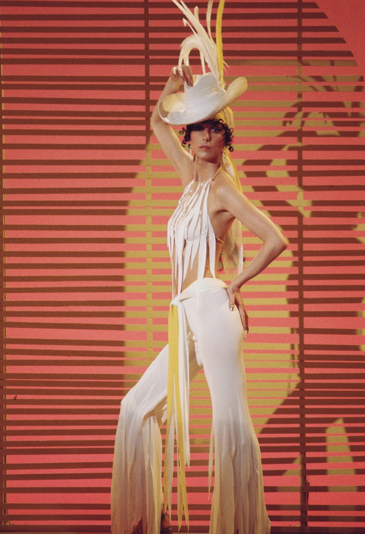 Cher posing in white