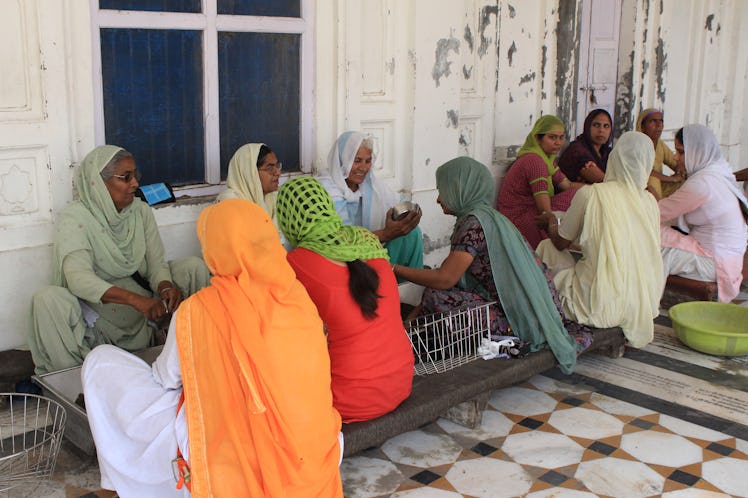 Women Cleaning Bowls Golden Temple Anndra Neen Annette and Phoebe Stephens India