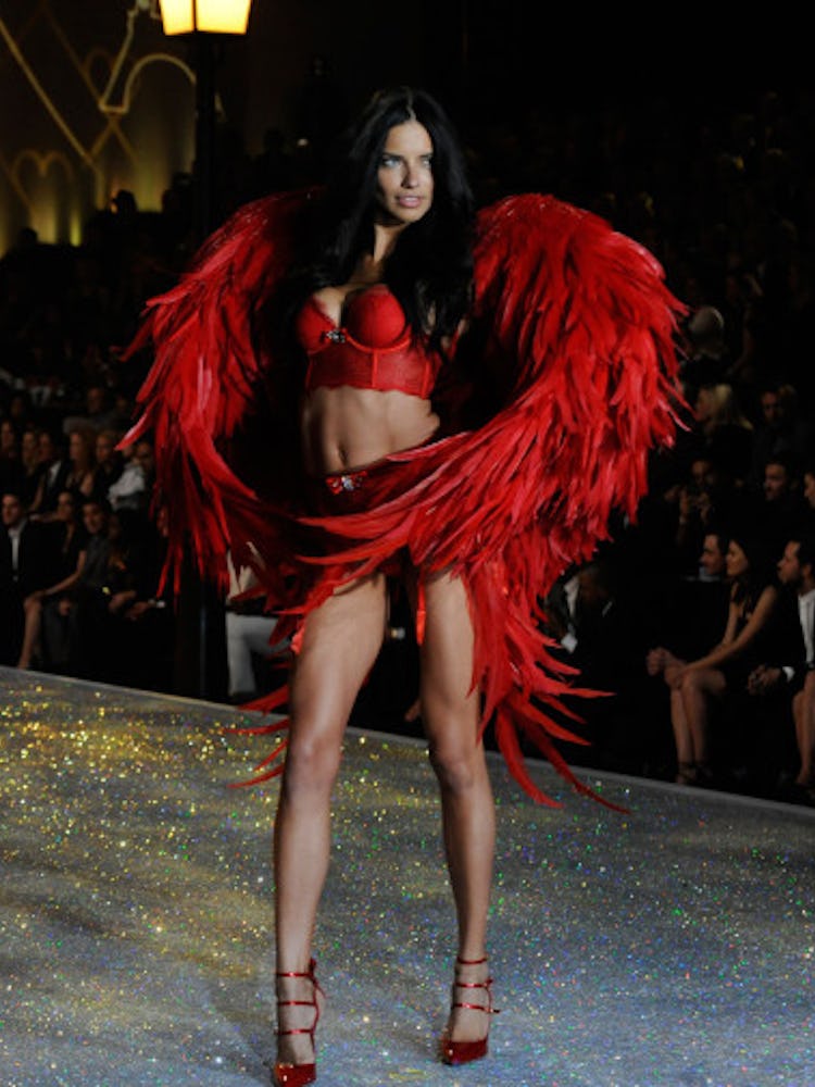 Adriana Lima wearing a pair of red wings for Victoria’s Secret show