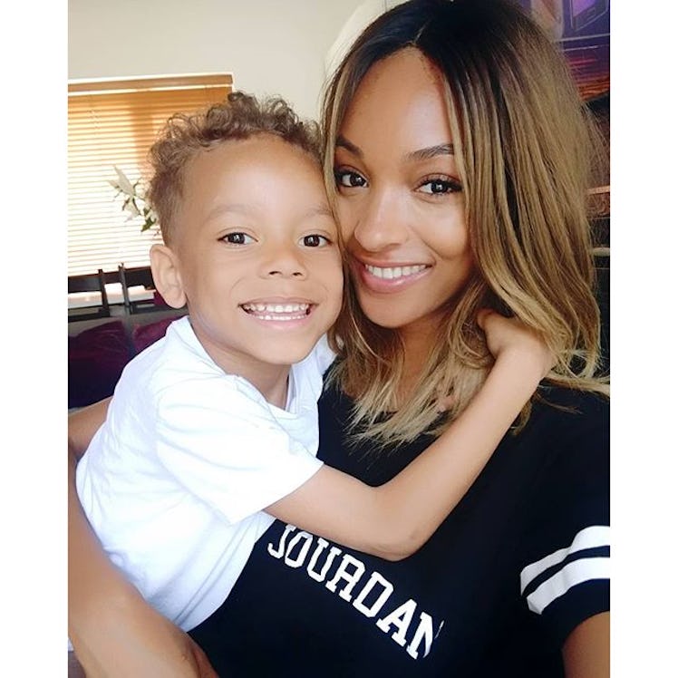 Jourdan Dunn, a mom supermodel, smiling and getting a hug from her son Riley.