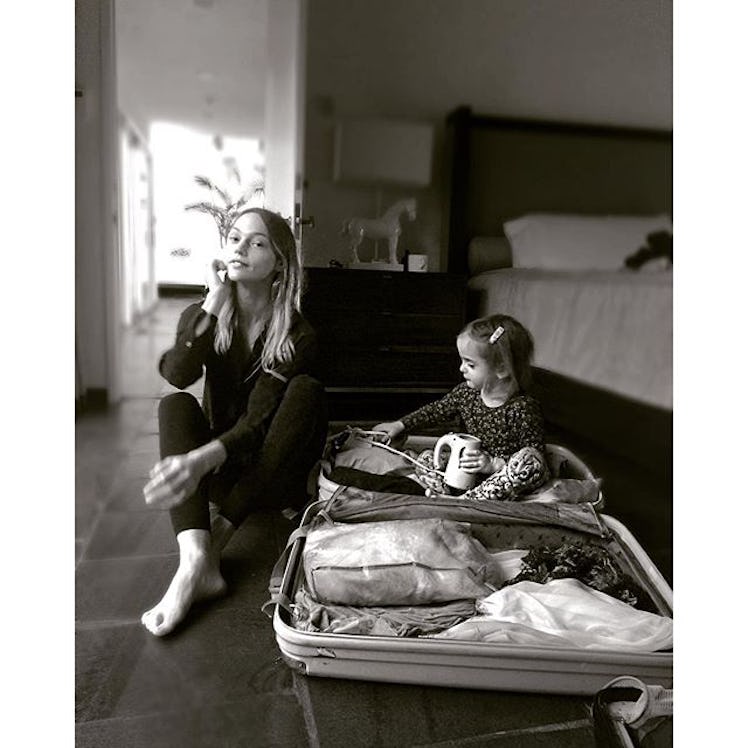 Mom supermodel Sasha Pivovarova packing with her daughter.