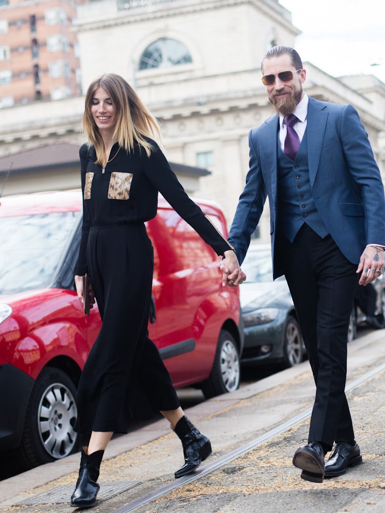 Justin O’Shea and Veronika Heilbrunner walking while holding their hands together outside the Gucci ...